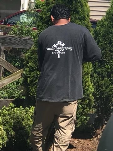 Rauda Landscaping team member working at a residential property