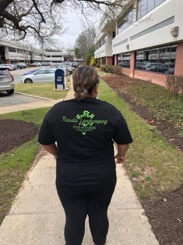 Rauda Landscaping team member at a commercial property